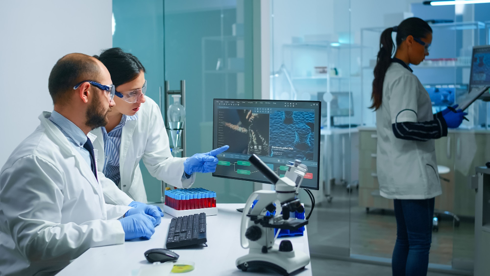 chemist doctor explaining coworker vaccine development dna mutations working equipped laboratory (1)